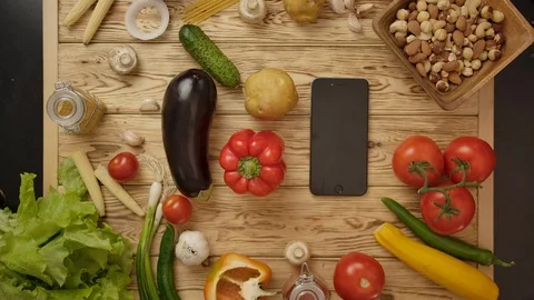 Faceless people taking vegetables from table Stock Footage 119970432