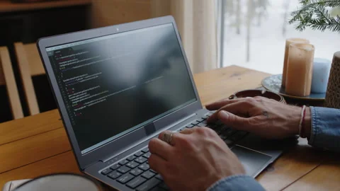 Faceless Programmer Deleting Code and Typing Again on Laptop Indoors Stock Footage 286088830