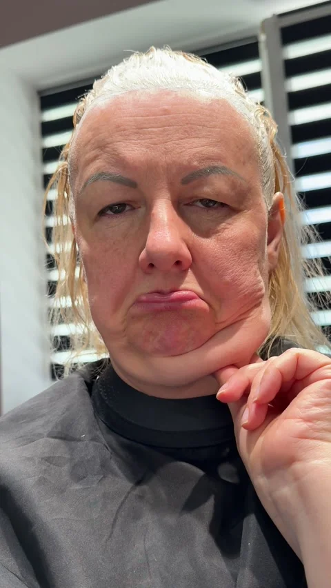 Facelift Desire and Aging Concerns as Sad Mature Woman Examines Sagging Neck Stock Footage 345181917