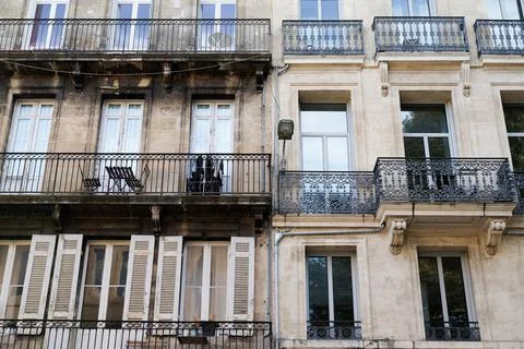 Facelift difference between ancient wash cleaned old house building facade wa Stock Photos