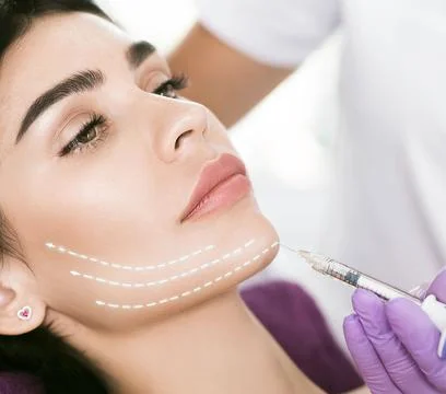 Facelift using beauty injection, non surgery. Beautiful mid aged woman gettin Stock Photos