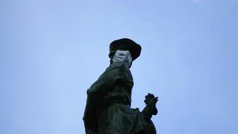 Facemask Over Statue during the Coronavirus Pandemic Stock Footage 152738470