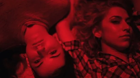 Faces of a girls in red light close-up Stock Footage 76508662