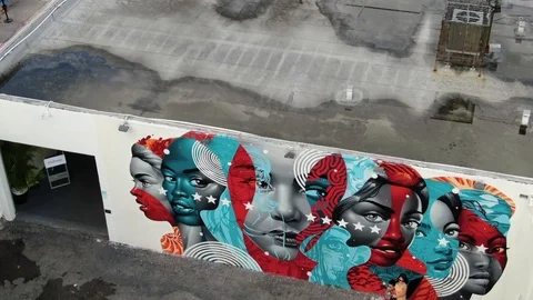 Faces Mural Above an Empty Wynwood Parking Lot in Miami Stock-Footage 100092510