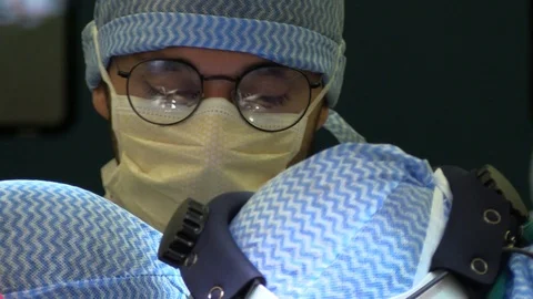 Faces of surgeons in operation Stock Footage 85924115