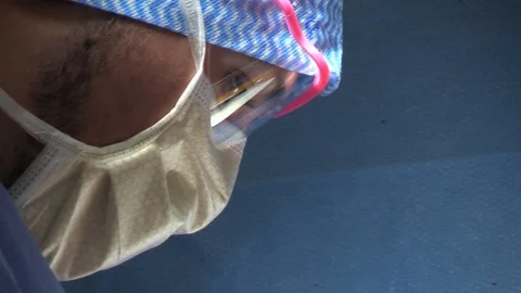 Faces of the surgeons in operation Stock Footage 85941146