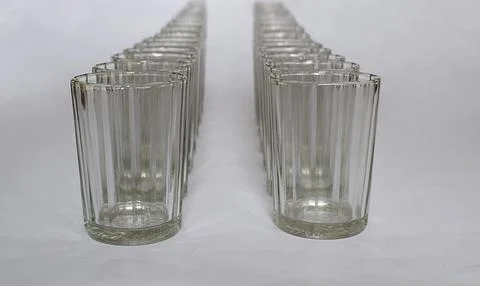 Faceted glasses in the form of two columns. Stock Photos