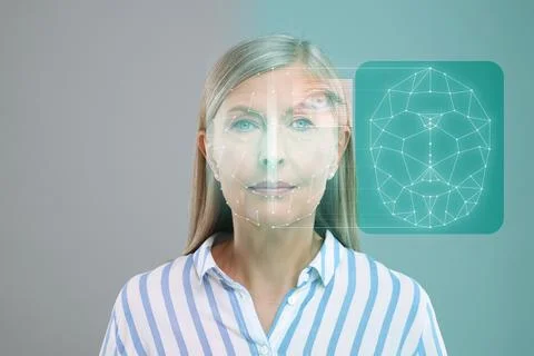 Facial and iris recognition system. Woman undergoing biometric verification.. Stock Photos