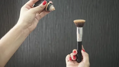 Facial base makeup and brush performing actions before applying. Stock Footage 137677136
