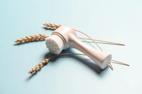 Facial brush with wheat ear. Stock Photos