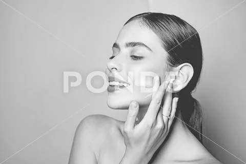 Facial care for female. Keep skin hydrated regularly moisturizing cream. Fresh Stock Photos