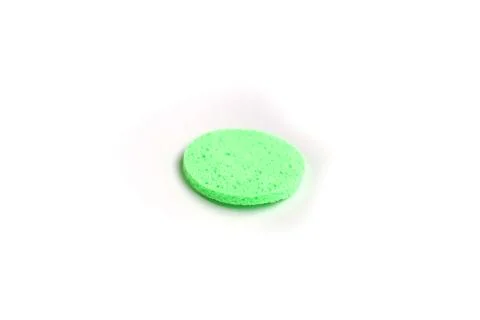 Facial cleansing sponge on a white background Stock Photos