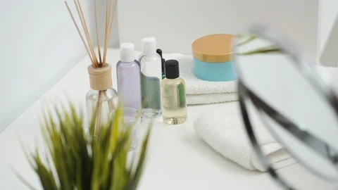 Facial cosmetics on the table in the bathroom Stock Footage 128857428