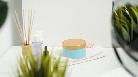 Facial cosmetics on the table in the bathroom Stock Footage 128898621