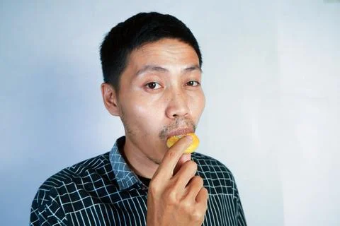 Facial expression of eating biscuits Stock Photos