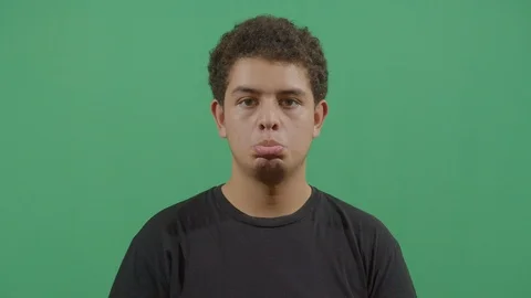 Facial expression of a young boy pouting in ecuador Stock Footage 115338549