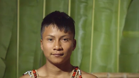 Facial expression of a young boy smiling in ecuador Stock Footage 113180412