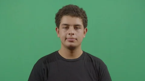 Facial expression of a young boy smiling in ecuador Stock Footage 115338548