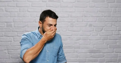 Facial Expressions Of Young Beard Man On Brick Wall Stock Footage 87672713