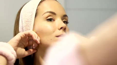 Facial lifting massage using knuckles on chin during skincare routine Stock Footage 308412324