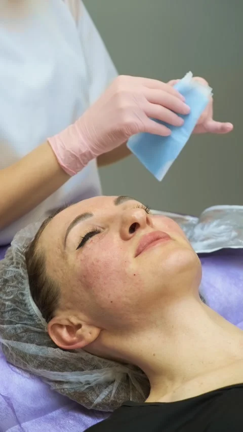 Facial mask preparation process in beauty clinic with cosmetologist treating 스톡 동영상 333776844