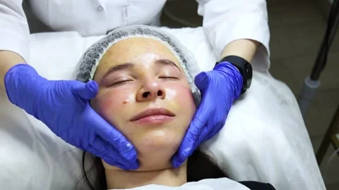 Facial massage with a special solution called biorepeel, the procedure is in a Stock Footage 278100507