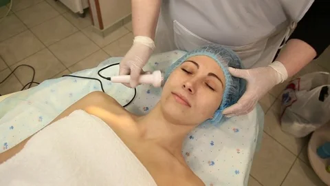 Facial massage using specialized equipment Stock Footage 71484408