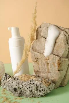Facial product sample on a stone and spikelet Stock Photos