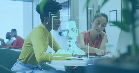 Facial recognition animation over diverse colleagues discussing work at desk Stock Footage 305727393