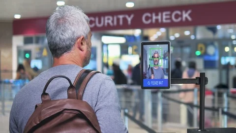 Facial recognition man goes through airport security check screening Stock Footage 122377172