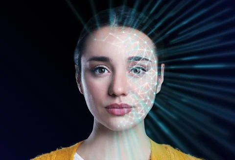 Facial recognition system. Scanning woman's face for authentication Foto stock