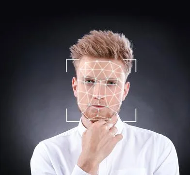 Facial recognition system. Young man with scanner frame and digital biometric Stock Photos