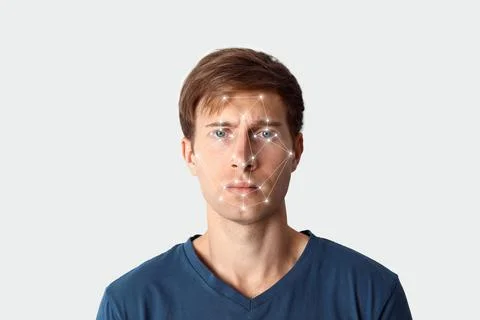 Facial recognition system. Young man with digital biometric grid on white bac Foto stock