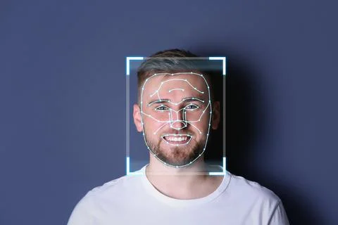 Facial recognition system. Young man with scanner frame and digital biometric 스톡 사진