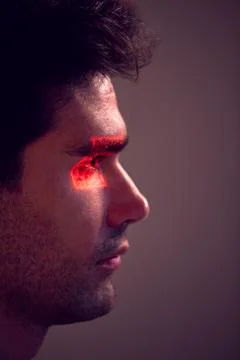 Facial Recognition Technology Concept As Man Has Red Grid Projected Onto Eye In Stock Photos