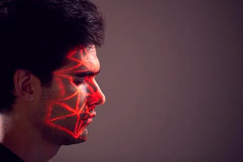 Facial Recognition Technology Concept As Man Has Red Grid Projected Onto Face In Stock Photos