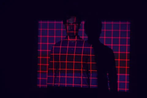 Facial Recognition Technology Concept As Man Has Red Grid Projected Onto Body In Stock Photos