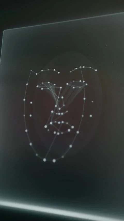Facial recognition technology displaying a 3D facial mesh structure Stock Footage 333822609
