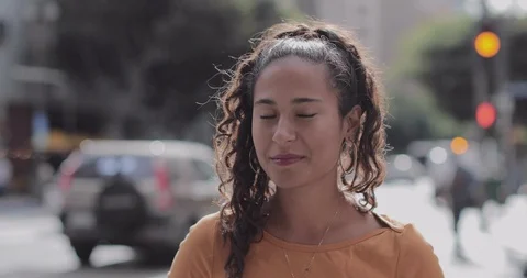 Facial recognition technology scanning identity of hispanic female on city road Video stock 123836716