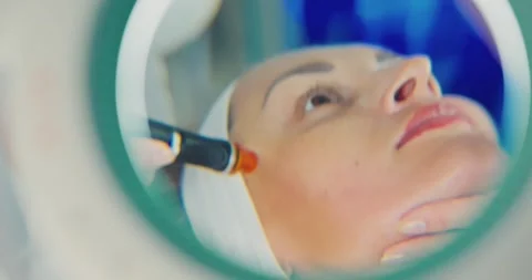 Facial Treatment with Device in a Spa Setting 스톡 동영상 323611579