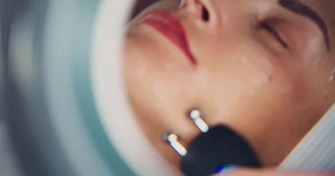 Facial Treatment with Microcurrent Device in a Spa Setting 스톡 동영상 323607528