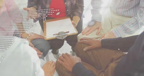Facilitator lifting clipboard tapping pen to prompt tech collaboration while map Stock Footage 318626040