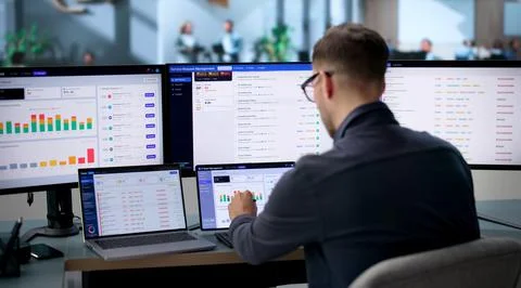 Facility Manager Uses Laptop To Track Maintenance Requests And Manage Repairs Stock Photos