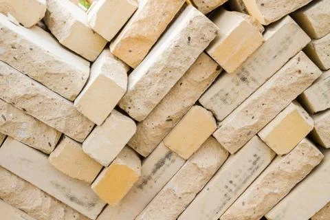 Facing bricks stacked in a warehouse building base Stockfoto's