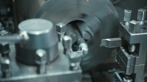 Facing operation of a metal blank on turning machine with cutting tool. Stock Footage 224945324