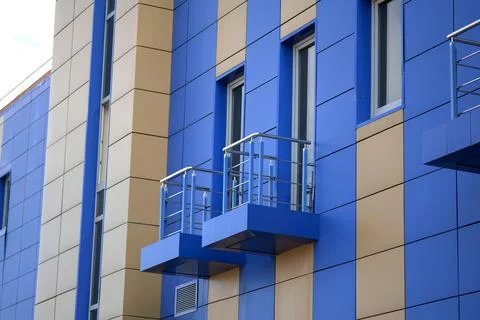 Facing panel in gray and blue for the wall of a multi-story Stock Photos