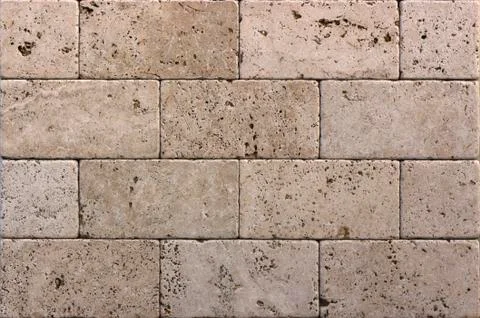 Facing tile from travertine with a smooth surface Stock Photos