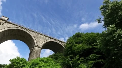 Facing upward perspective of driving under tall Railway bridge in Newquay. Stock Footage 65440911