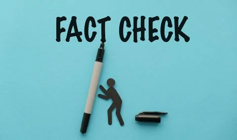 Fact Check concept with small paper human figure supporting a marker on a b.. Stock Photos