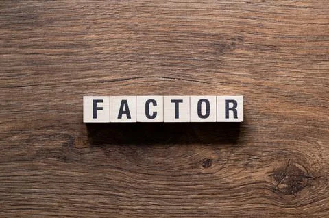 Factor - word concept on building blocks, text Stock Photos